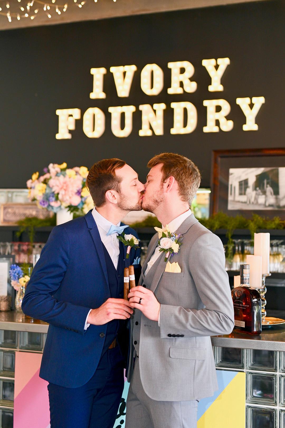Two Grooms Kissing