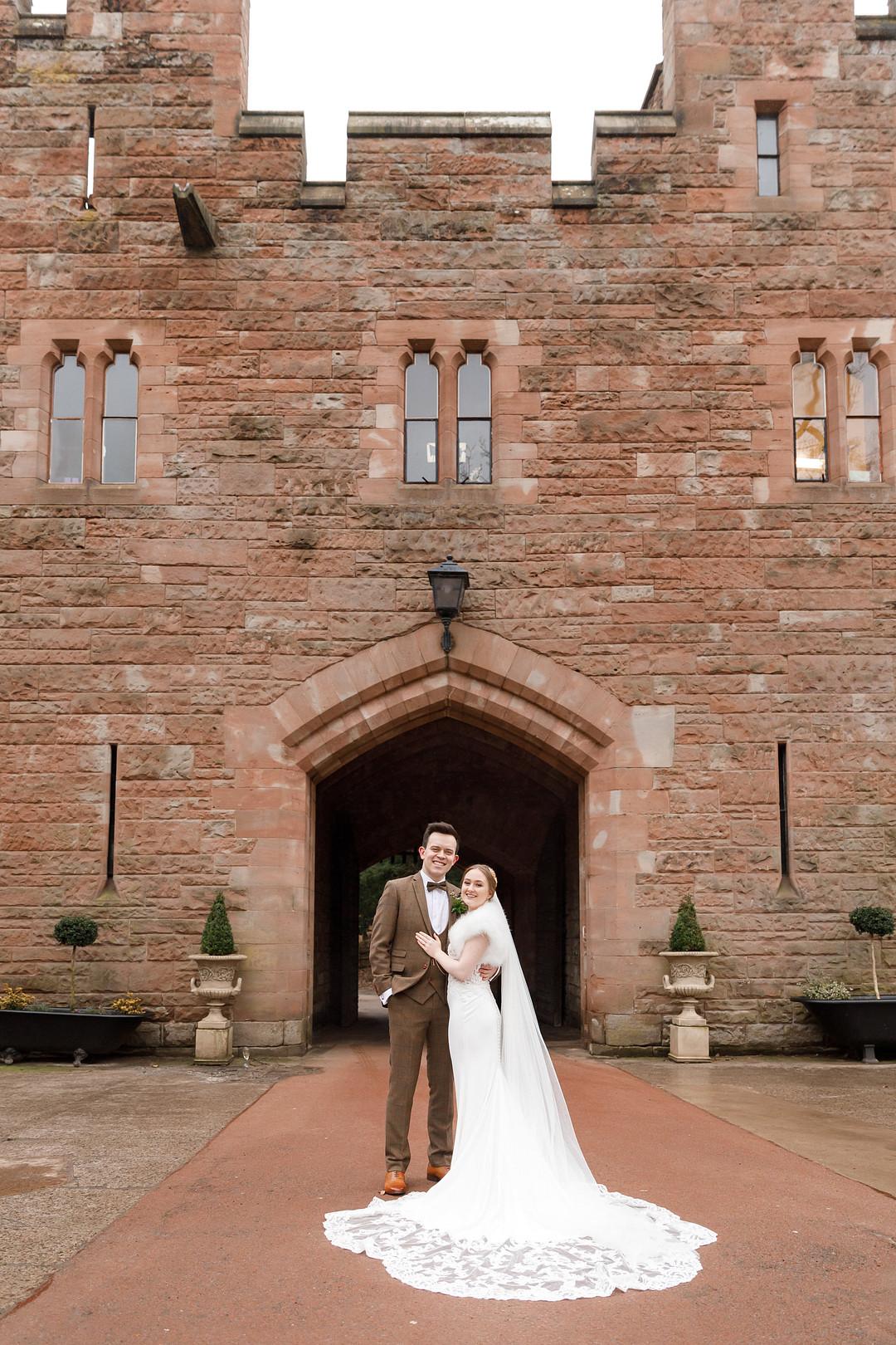 Bride and Groom in Front of Their Venue