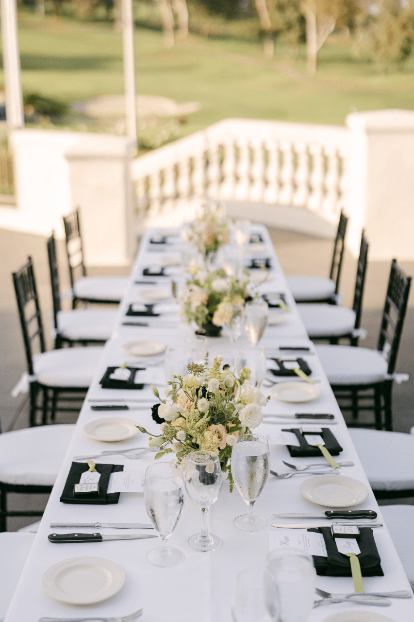 Farm Tables with multiple flower arrangements
