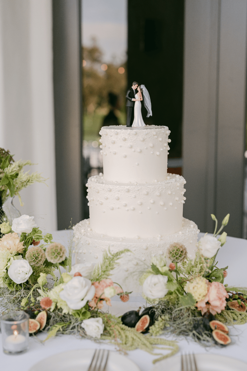 Mini flower meadow for the 3 tiered cake,,accent with pearls.