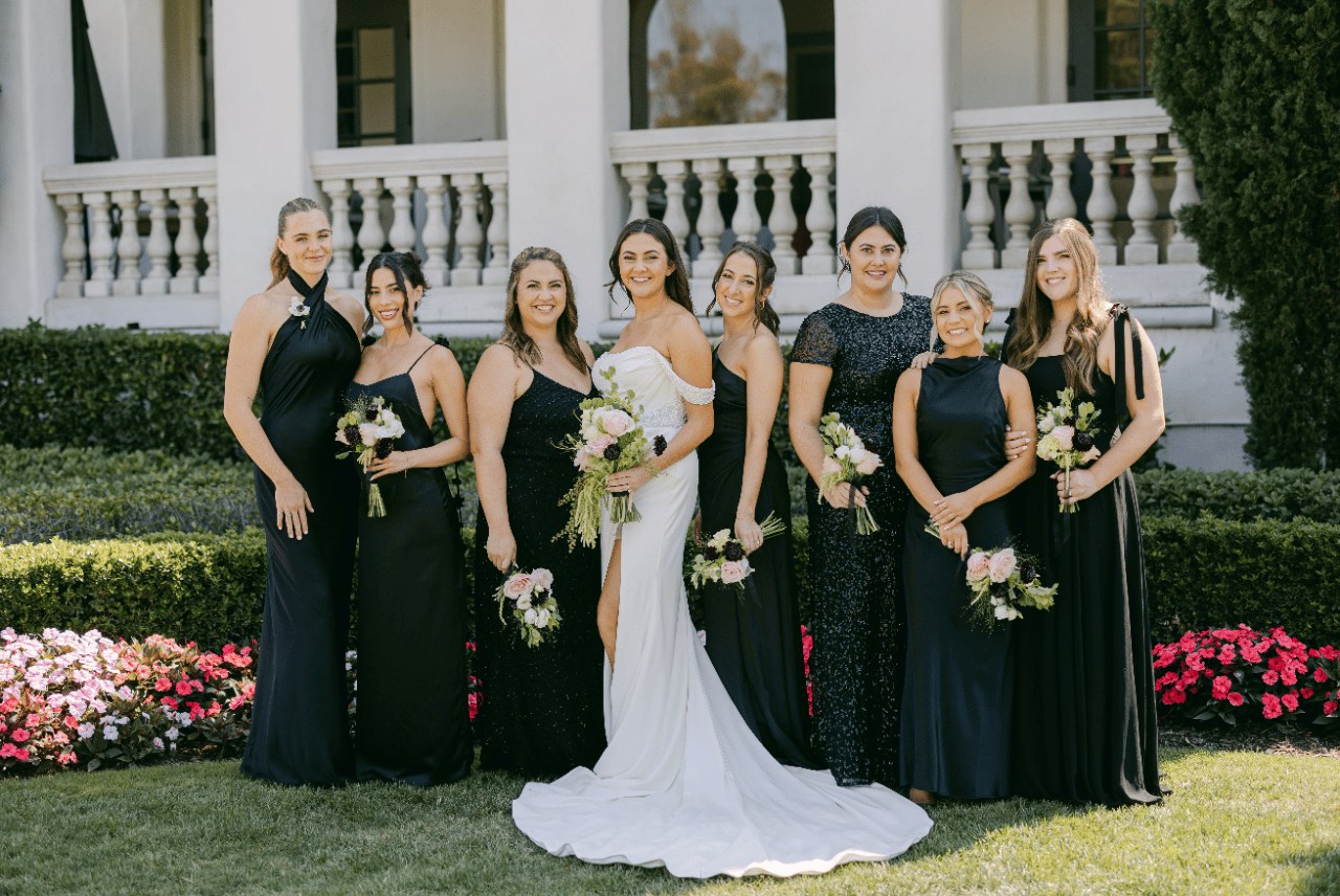 Morden Vitange Hollywood glam Bride with her bridesmaids and officiant.