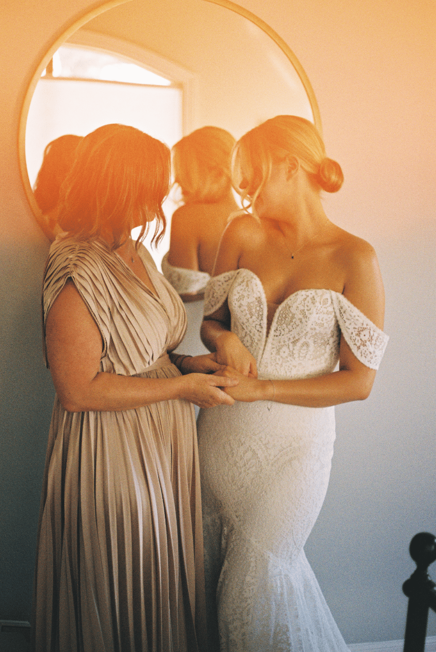 Bride & her MIL sharing a moment on 35 mm film