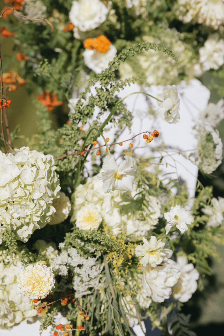 Seasonal florals layered with texture and movement.