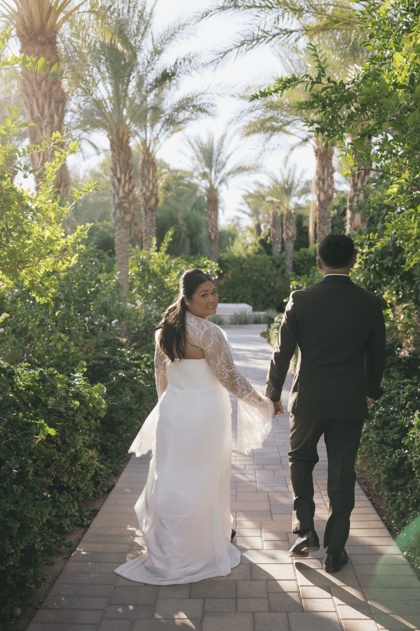 Hand in hand through desert gardens.