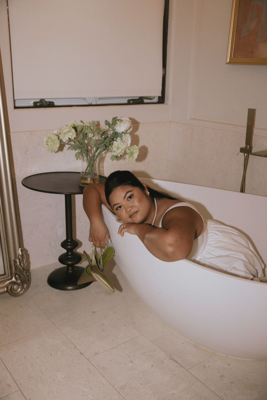 A playful bridal portrait in the bath.