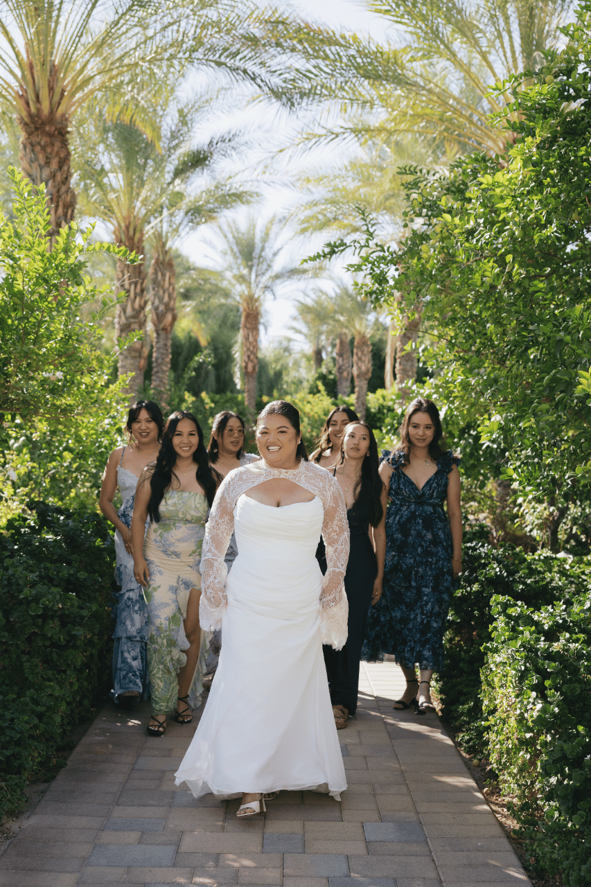 Bridesmaids gathered in garden tones.