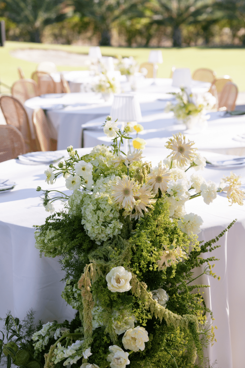 A floral arrangement grounding the tablescape.