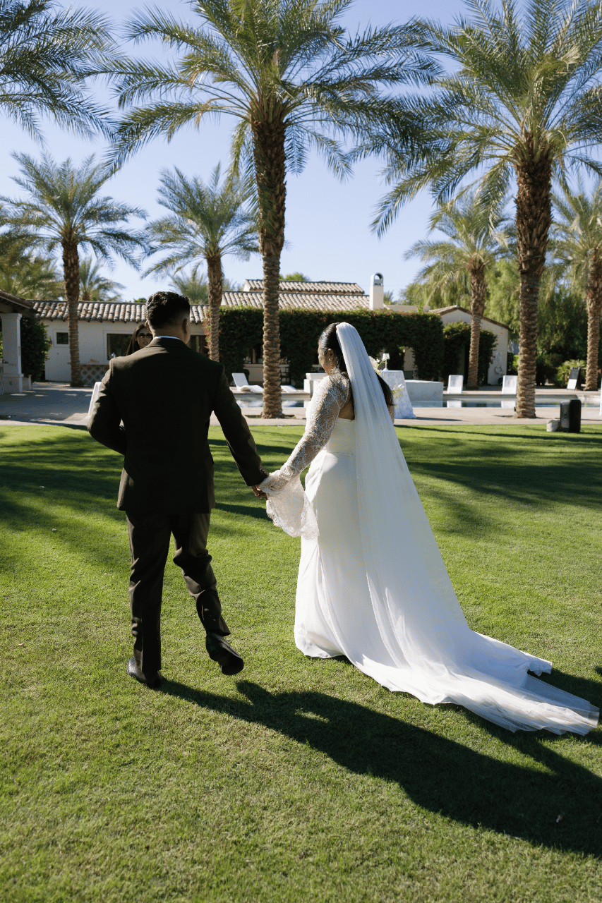 A quiet walk beneath desert palms.