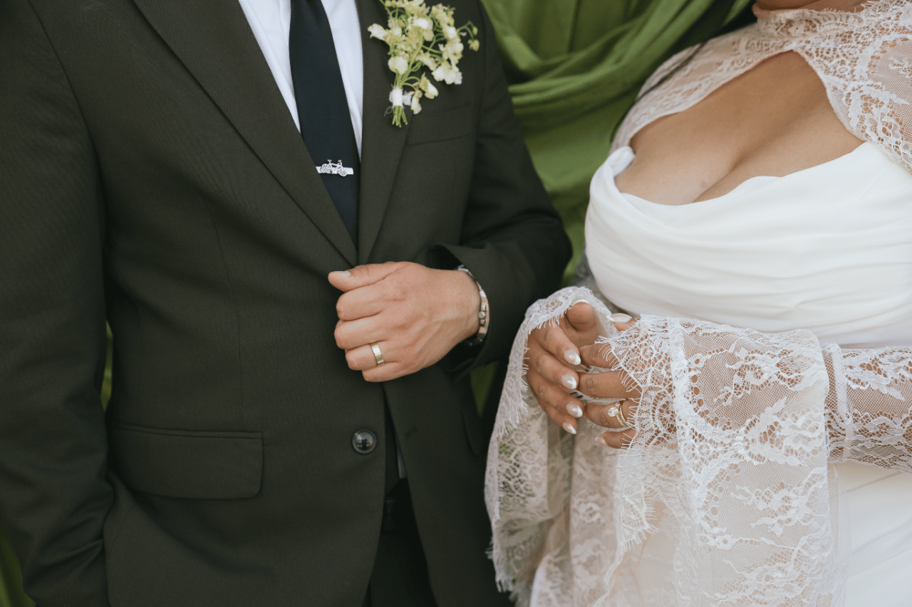 A refined detail of lace and suiting.