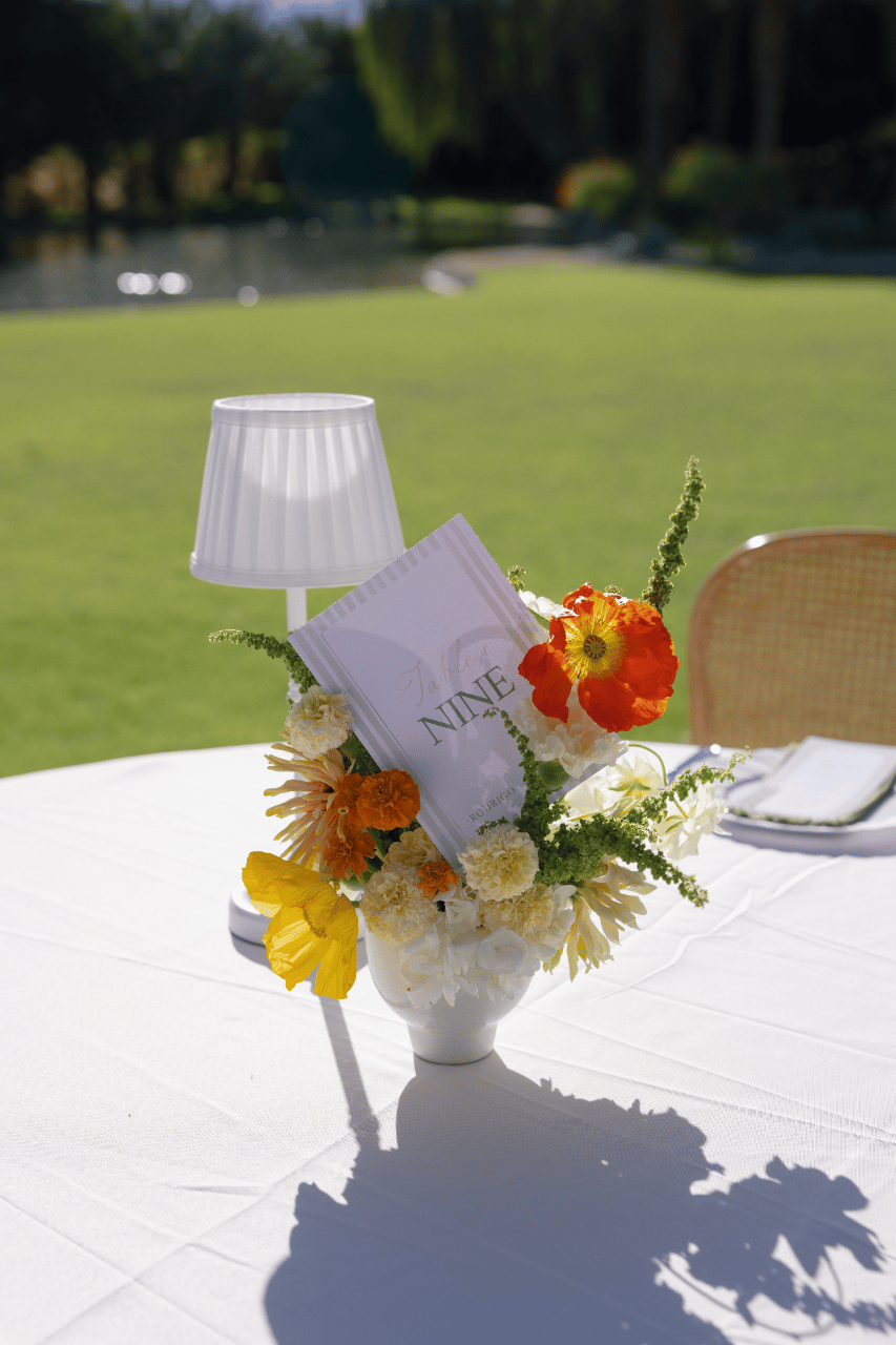 A floral centerpiece accented with warm citrus tones.