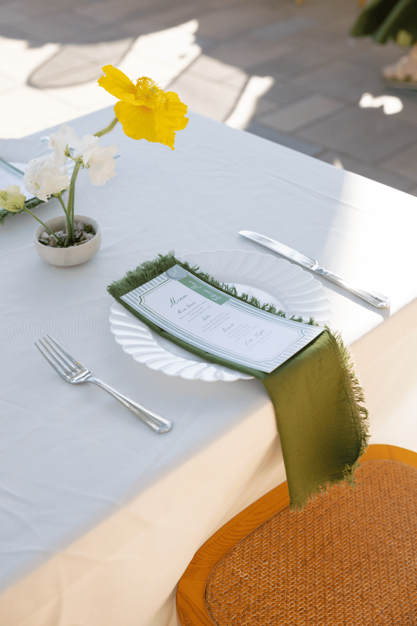 A minimalist place setting with a fresh yellow accent.