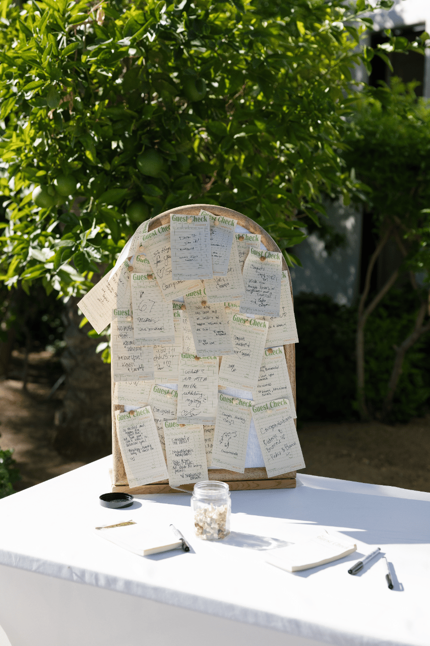 A handwritten seating display with personal notes