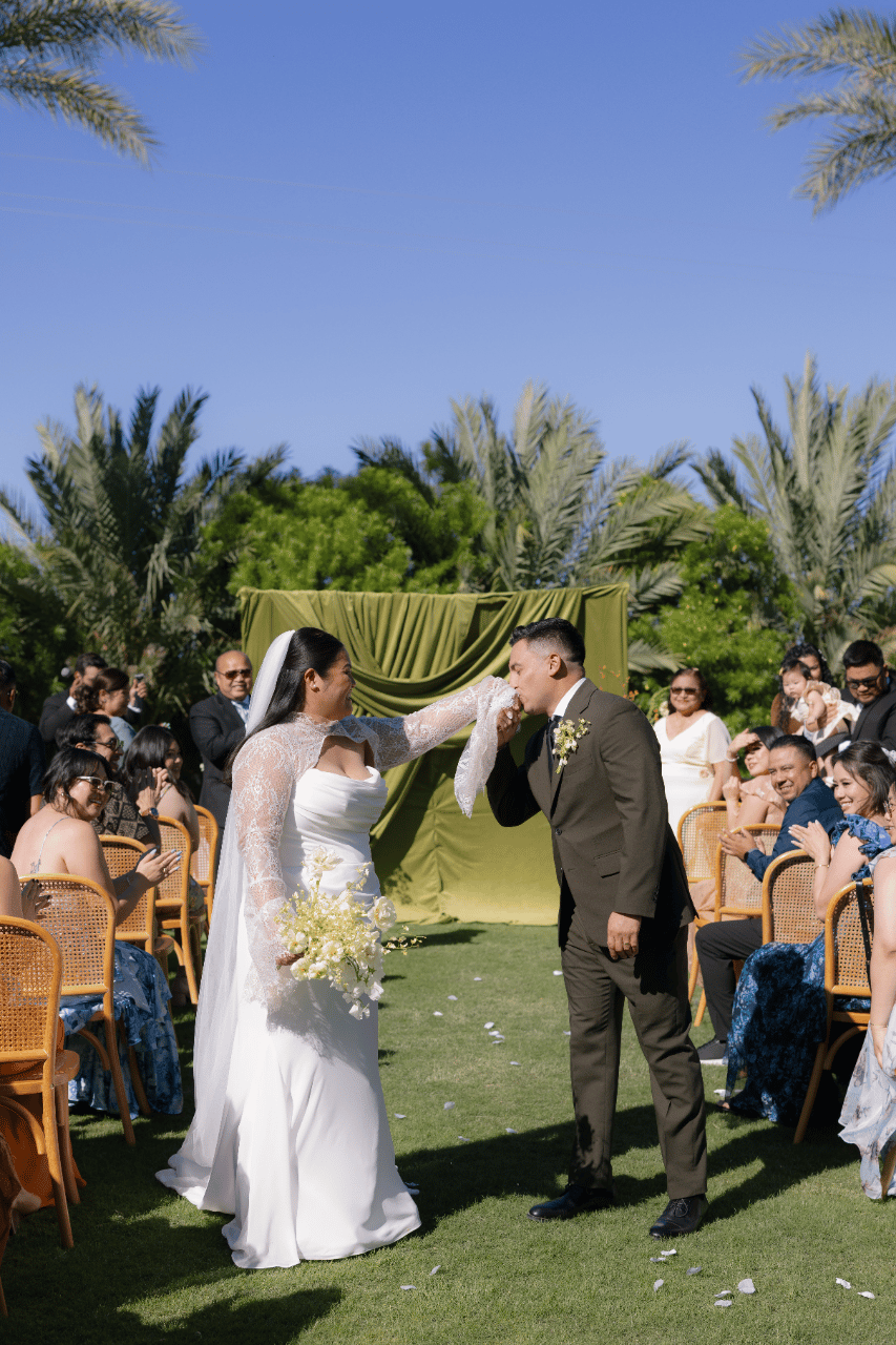 Newlyweds celebrating down the aisle.