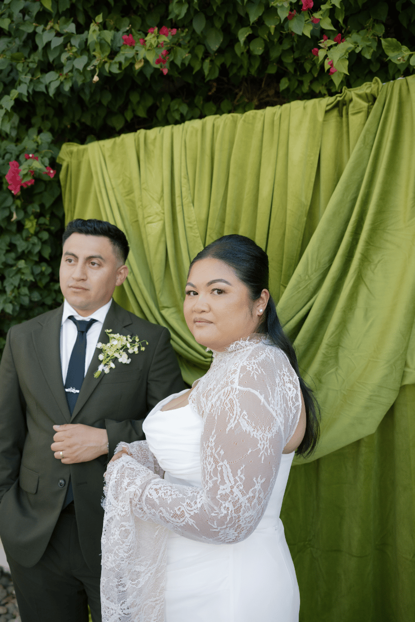 A classic portrait framed by layered greenery.