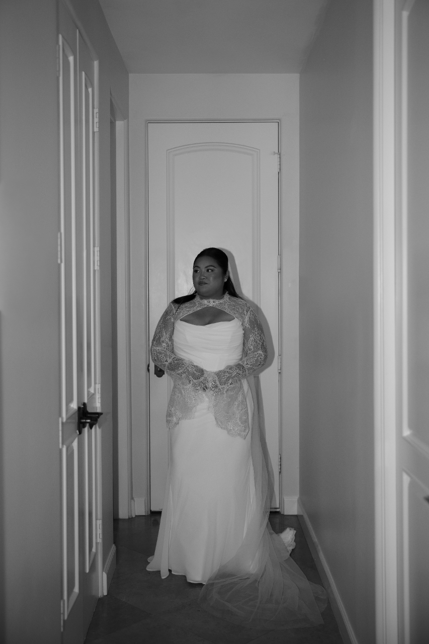 A minimalist hallway portrait emphasizing form, texture, and movement.