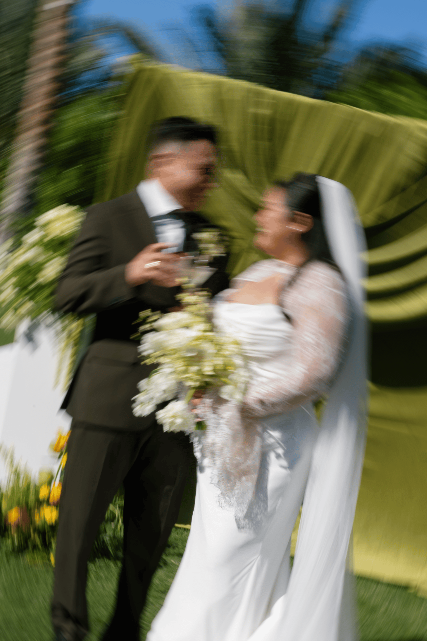 A classic portrait framed by layered greenery.