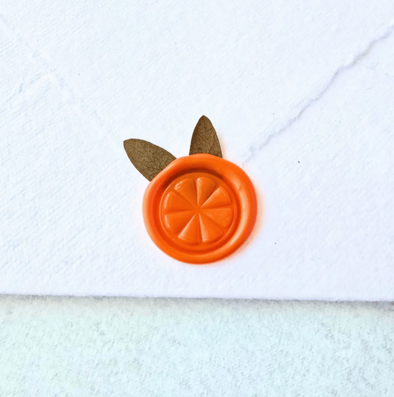 Orange Wax Seal with Dried Botanicals